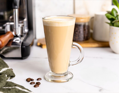Coffee Beans, Coffee Cup and Filter Coffee Machine on a table top