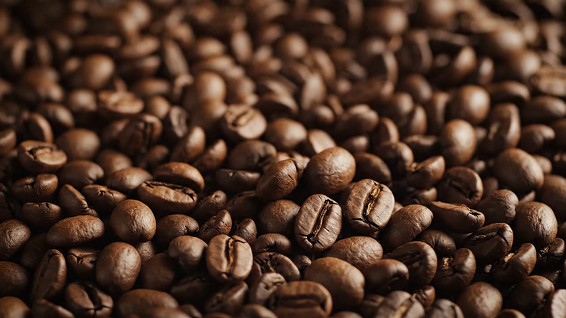 Coffee Beans falling onto pile of coffee beans