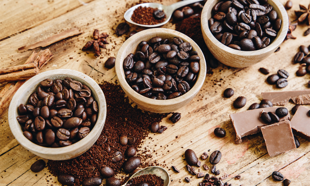 Various Whittard of Chelsea Coffee Beans in Bowls On Kitchen Worktop