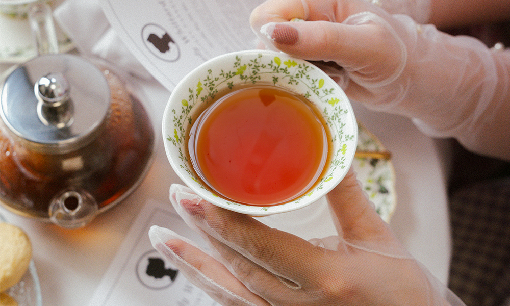 Lady Drinking a Cup of Whittard Earl Grey Tea